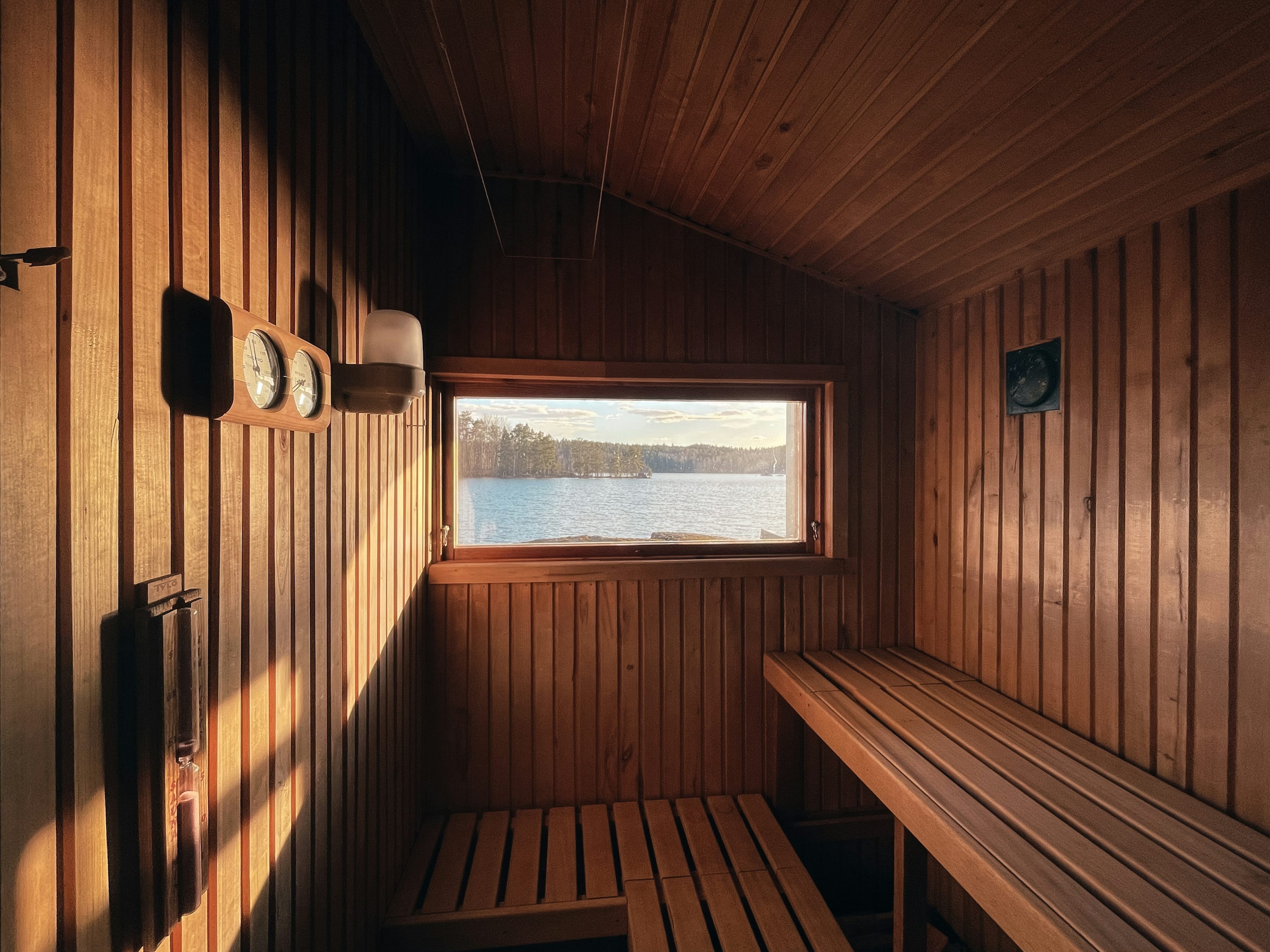 Infrared sauna interior with red light therapy panels glowing